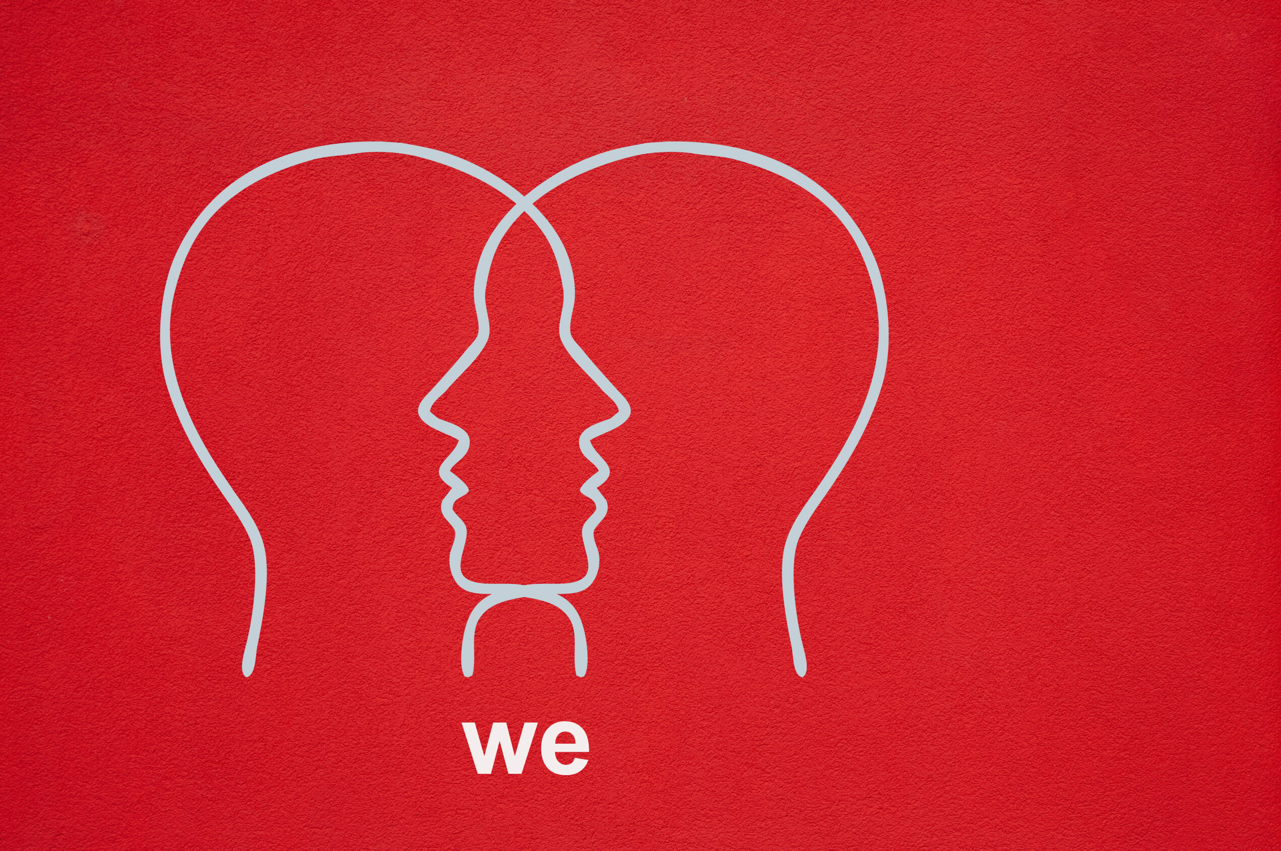 The word we is written under the outlines of two heads that overlap. The outline of the heads is in white against a crimson background.